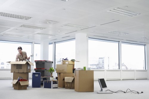 Professional movers loading household furniture carefully