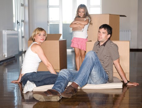 Bulky household furniture being removed from a local property